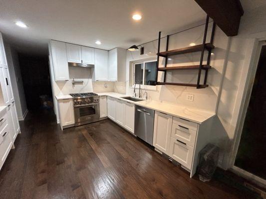 Quartz countertop with rising quartz backsplash and window sill