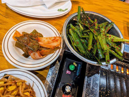 Banchan (Korean side dishes) included with our Combo A ($59.99). Spicy pickled pepper and onion and spicy chives.