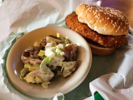 The renowned king crab burger with potato salad