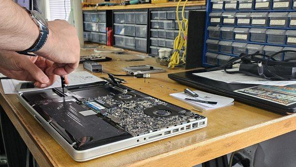 Working diligently on a Macbook Pro.