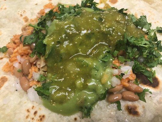 Pollo asado burrito with rice, beans, cilantro, onions, salsa