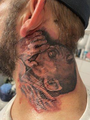 Tattoo of devil whispering in ear