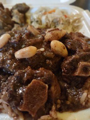 Curry Goat and Oxtail Combo, Beans, Rice, Cabbage Stir Fry. Shredded cabbage, carrot and red bell peppers cooked to perfection.