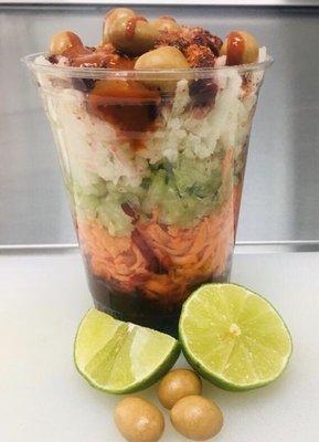 Shredded veggies topped with peanuts, lemon and chamoy! a Mexican dessert you must try !!!