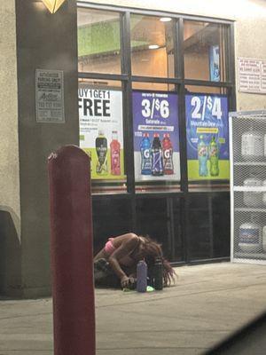 This photo is in front of the store. People are begging, not safe, not secured three other homeless people just walked away.