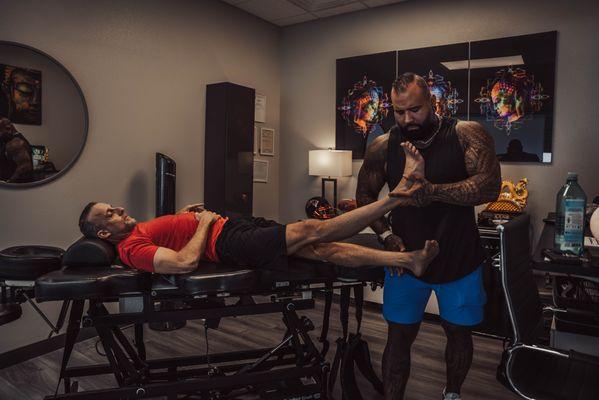 Client receiving advanced bodywork, targeting deep muscle relief, improving flexibility, and enhancing recovery