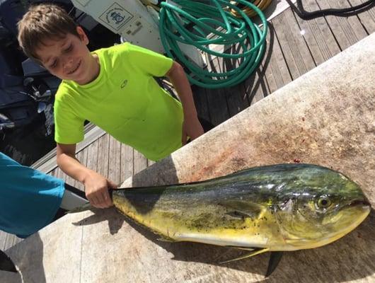 This boy caught his first dolphin