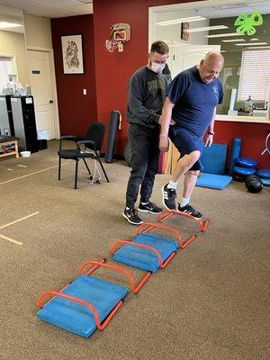 Brennan Hogan PT, DPT works with his balance patient.