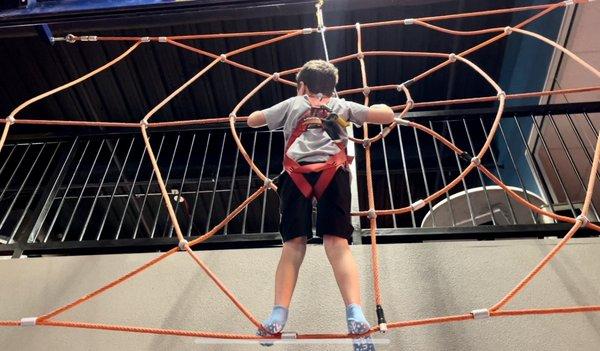 Also on the difficult side, crossing the spider web. This kid is fearless!