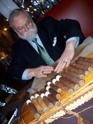 Master roller Leonard preparing an outer leaf.