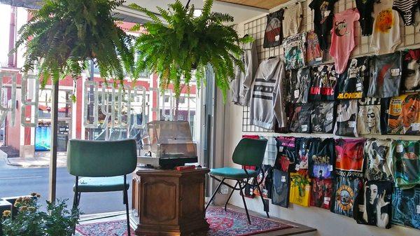 T-shirts and foliage in the front window on Milwaukee Ave.