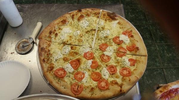 White pizza, half tomato & half tomato.