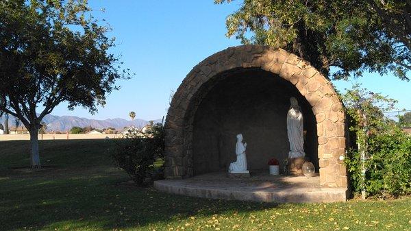 This grotto on campus shows Mary with Bernadette, SFV homes and palm trees beyond, and foothills defining L.A.'s northern edge. (no review)