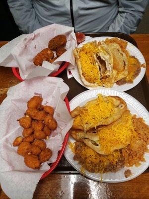 Two taco dinners with beans and rice.  Of course we tried the cheeseballs and poppers.