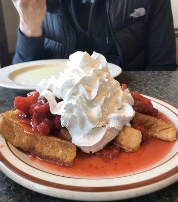 (Texas toast) French toast with frozen strawberries & a mountain of whipped cream. Perfect after bfast treat to split!