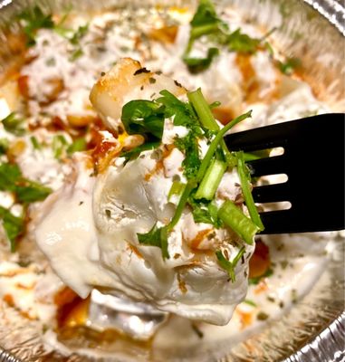 Matoo - steamed dumplings filled with mildly spiced meat & onions, in special sauce with split peas, yogurt, mint + garlic