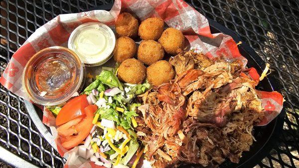 Polled pork with hush puppies and green salad