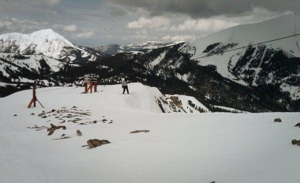 Luke about to drop into the awesome chutes on the mountain face.