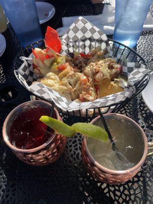 Nachos and peach & hibiscus mule