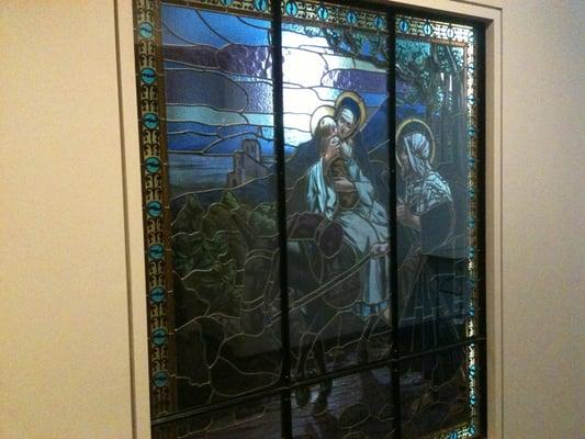 Glass stained window outside the chapel inside Trinity (other side)