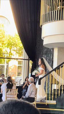 My dad and I walking down the aisle to the alter.