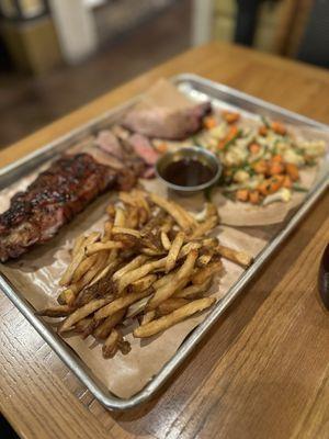 Three meat combo with veggies and fries.  Brisket, tri tip, baby back ribs