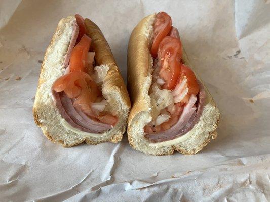 Ham and salami with onion and tomato.