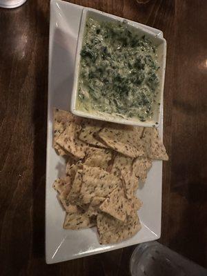 Spinach dip. Chips have seeds