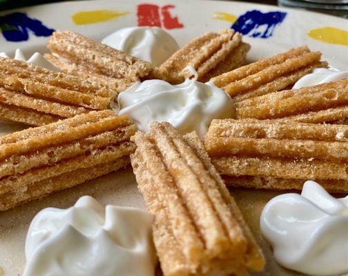 Churros with honey and whipped cream