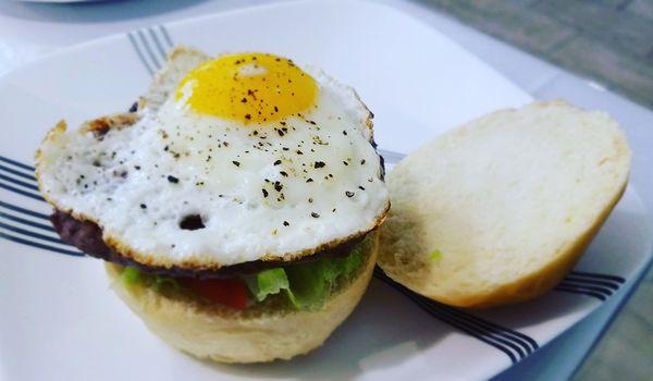 House bun, Burger topped with Sunny side egg