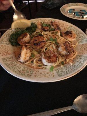 Blackened shrimp over olive oil linguine