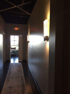 Hallway with pretty sconces