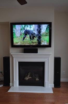 52" LCD with surround speakers installed.  Wires hidden.