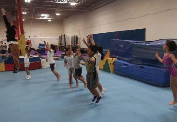 Coach James leads the birthday celebration group in fun pre-lunch gym time.