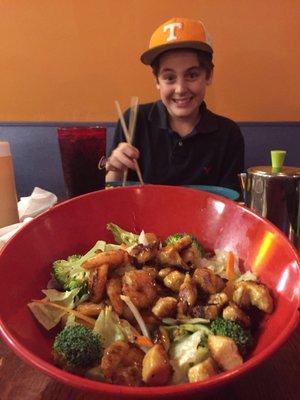 Connor enjoying his meal with my salad in the foreground