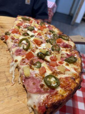 Hawaiian pizza with jalapeños.