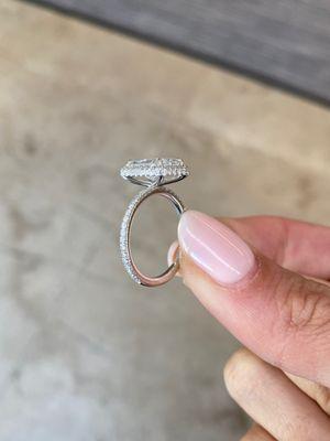 Side view of my ring created w/different designer.  Halo touches center stone all the way around...completely flush.