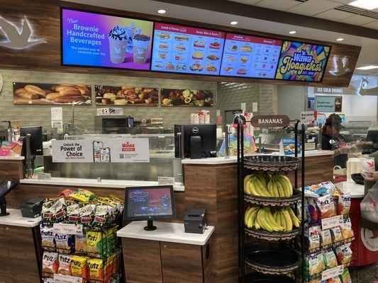 Ordering kiosks are around the deli counter