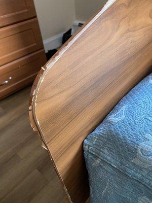 Foot of bed with peeling laminate