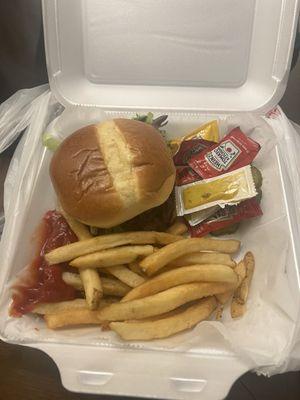 Burger and fries to go. Still hot when I got to the room. Gotta love a pretzel bun!