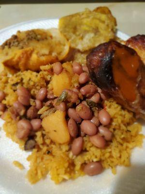 Half chicken, Beans and rice, garlic tastings and a potato ball with gravy