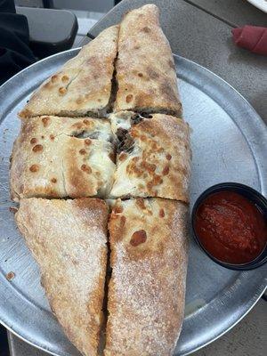 Steak and cheese calzone