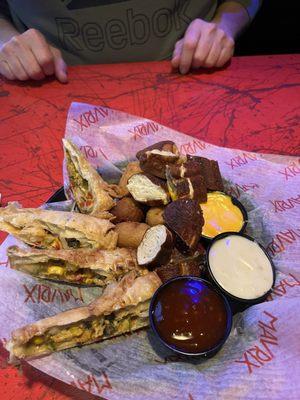 Combo with Chicken and Black Bean Egg Rolls, Pretzel Bites and Mini Corn Dogs....corn dogs were ok, rest was bad...