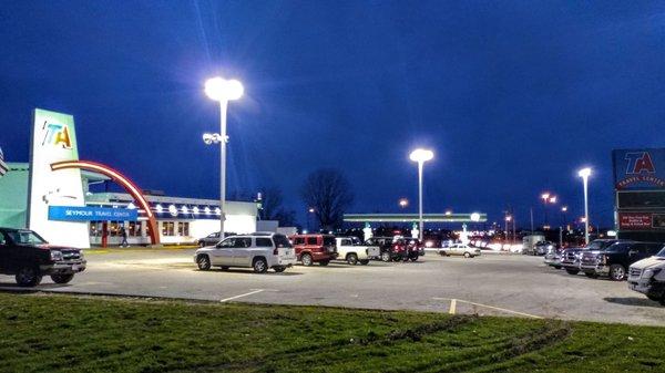 walking in from the overflow parking lot towards the TA in Country Pride night time shot lots of fluorescent lighting