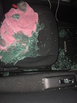 Man broke my car window and stole my purse.