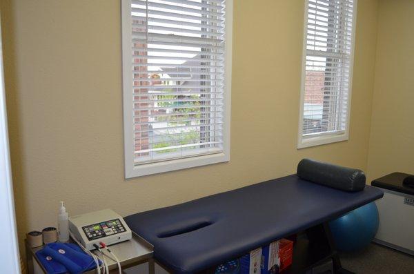 Rehabilitation room with muscle stimulation and cold laser.