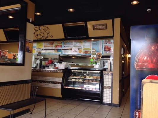 Nice clean register area with awesome looking display of to-go treats for home.