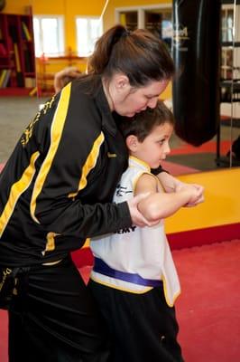 Senior Instructor uses hands-on methods to help a student master a punch. Our teaching combines the verbal, the visual, and t...