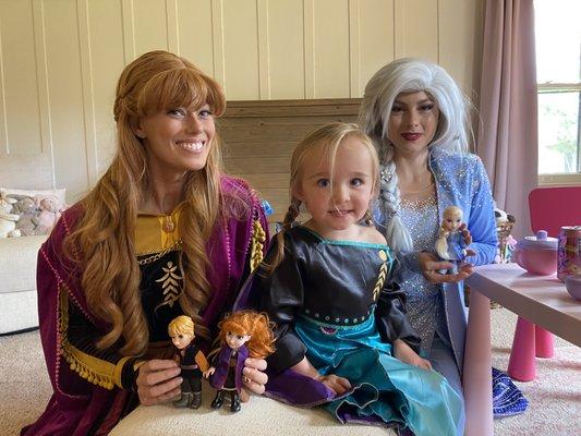 Anna and Elsa doing a tea party with the birthday girl.