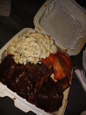 Short ribs of beef with macaroni salad and yams and the chicken dinner